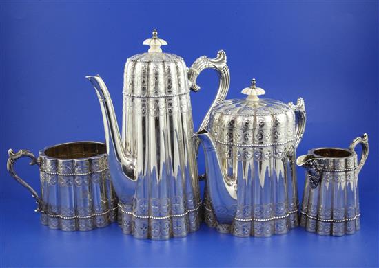 An ornate Victorian silver four piece tea and coffee set by John Edward Bingham (Walker & Hall), gross 67.5 oz.